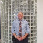 Mr. Wilson, the Vice Principal, standing in the Main Office